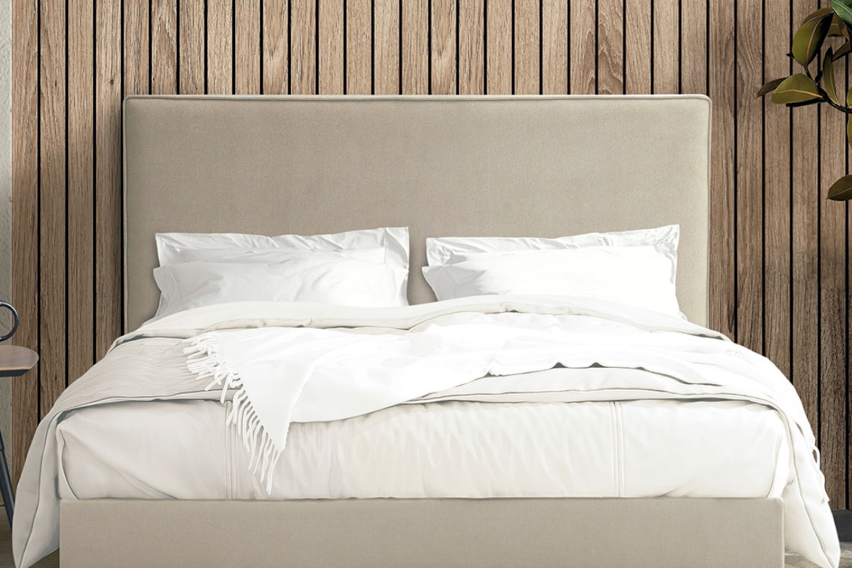 Cama tapizada moderna con cabezal modelo Lisboa de La Premier